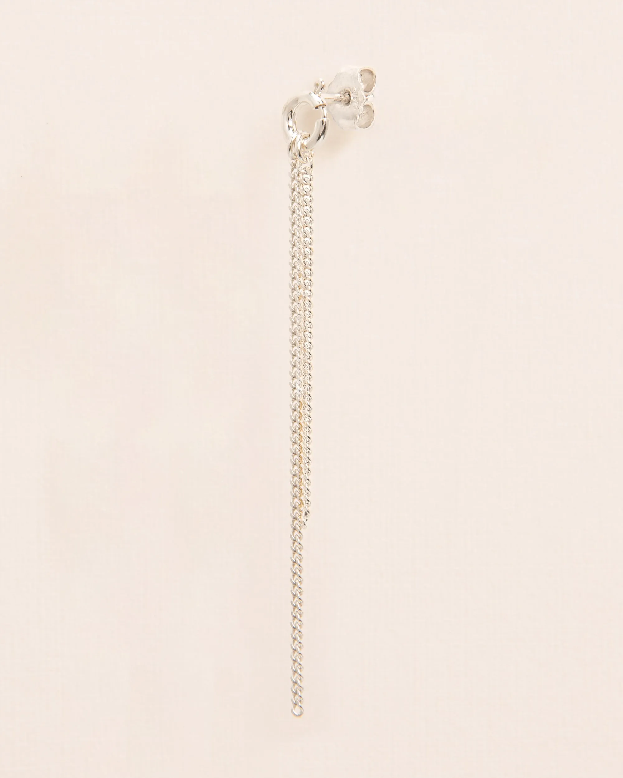 Single stud earring with spring ring and falling chains