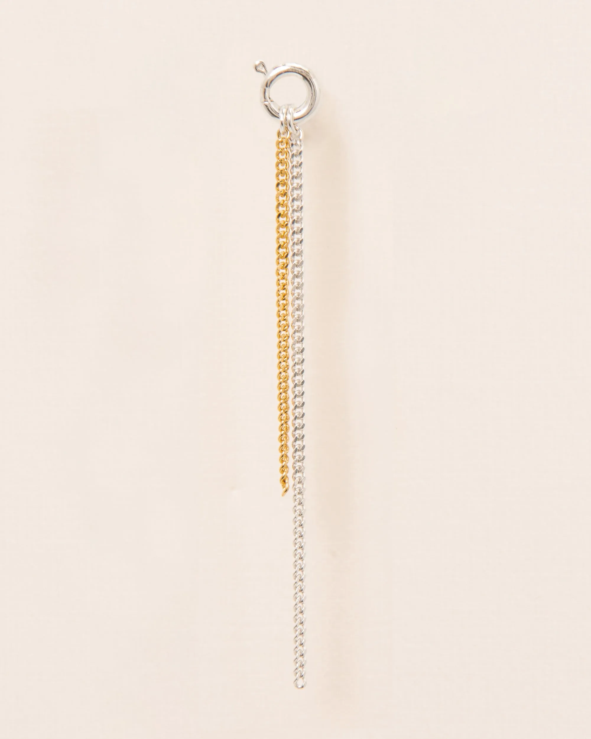 Single stud earring with spring ring and falling chains