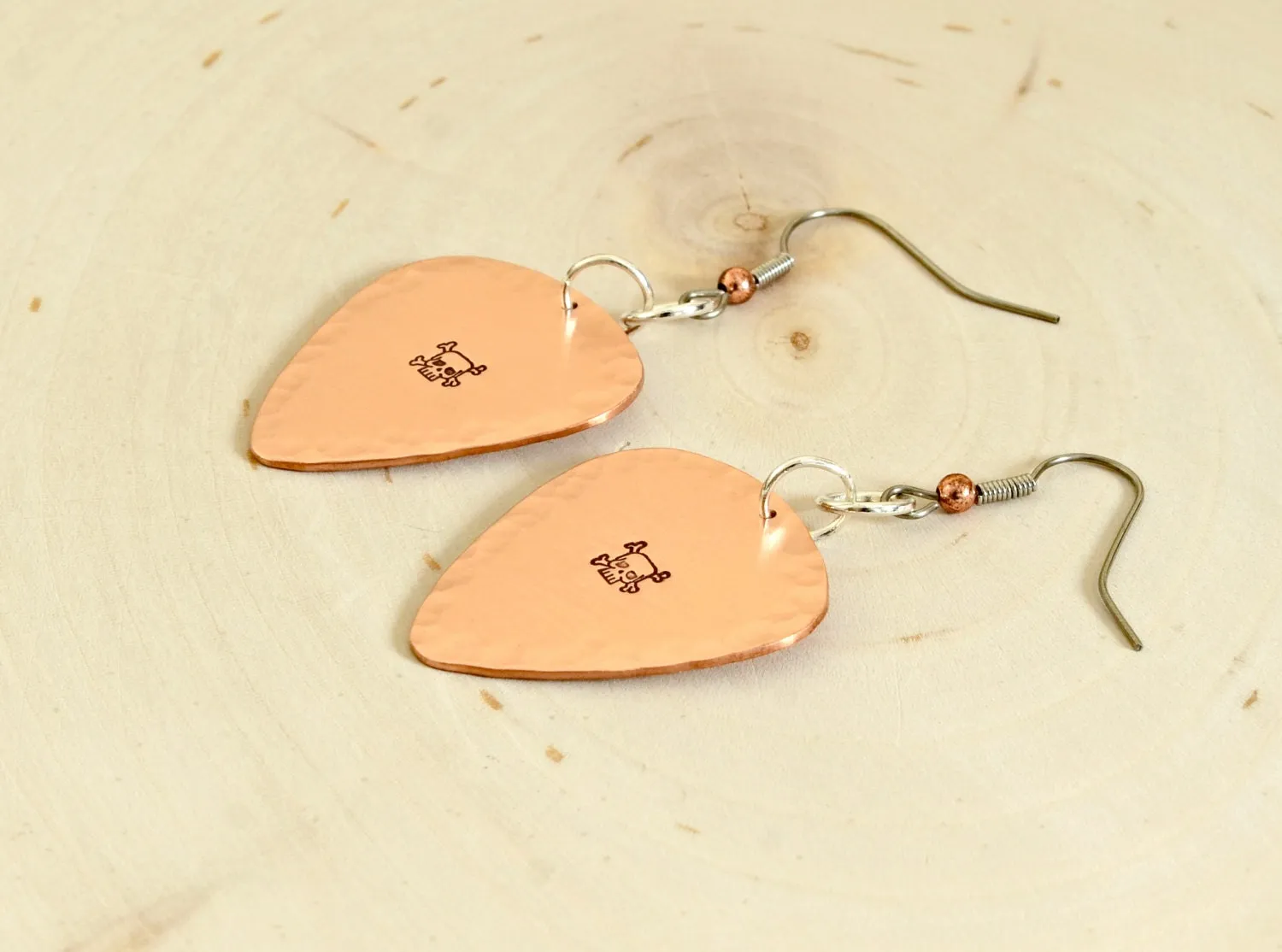 Skulls and crossbones on guitar pick earrings