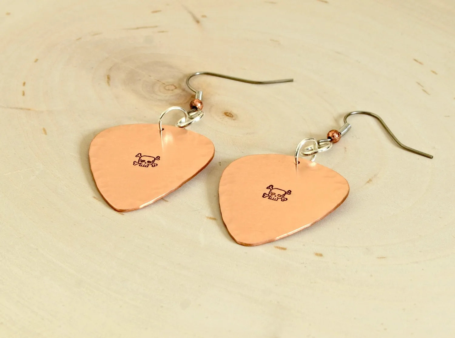 Skulls and crossbones on guitar pick earrings