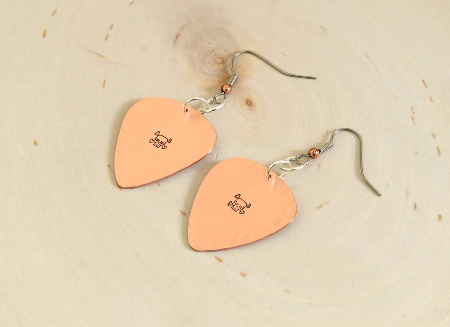 Skulls and crossbones on guitar pick earrings